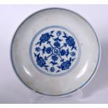 A CHINESE BLUE AND WHITE PORCELAIN DISH BEARING YONGZHENG MARKS. painted with stylised foliage. 17