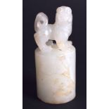 A 19TH CENTURY CHINESE CARVED WHITE JADE SEAL modelled with a Buddhistic lion seated upon a cylindr