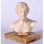 A PARIAN BUST OF A FEMALE, mounted to a rectangular onyx plinth. 14.5 cm x 14 cm.