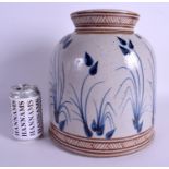 A LARGE STUDIO POTTERY BLUE AND WHITE STONEWARE JAR AND COVER possibly American, painted with sprig