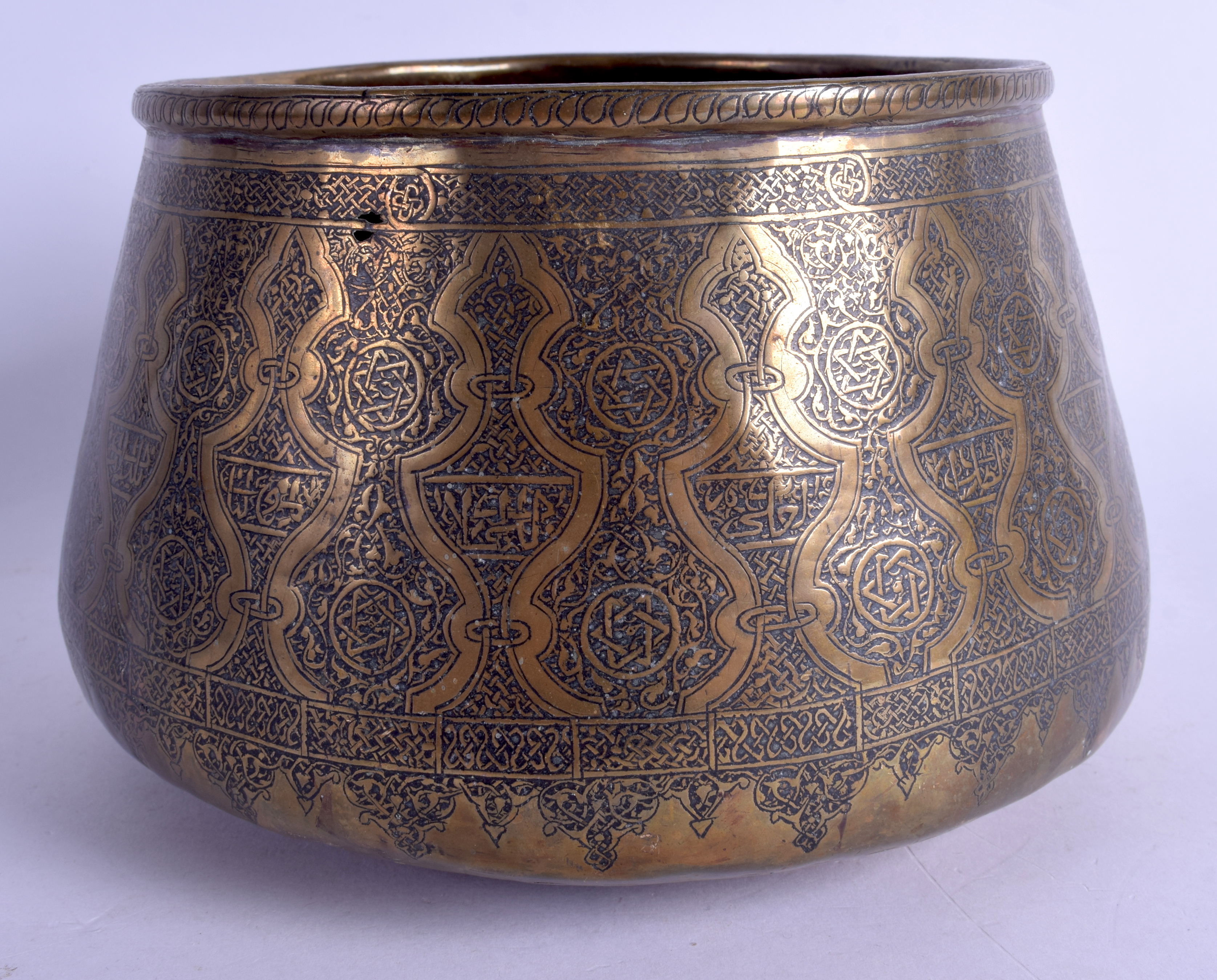 A 19TH CENTURY ISLAMIC MIDDLE EASTERN BRASS MAMLUK BOWL decorated with Kufic script. 20 cm x 14 cm.