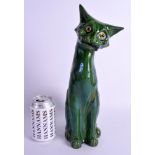 A LARGE CHARLES BRANNAM DEVON WARE GREEN GLAZED CAT 33 cm high.