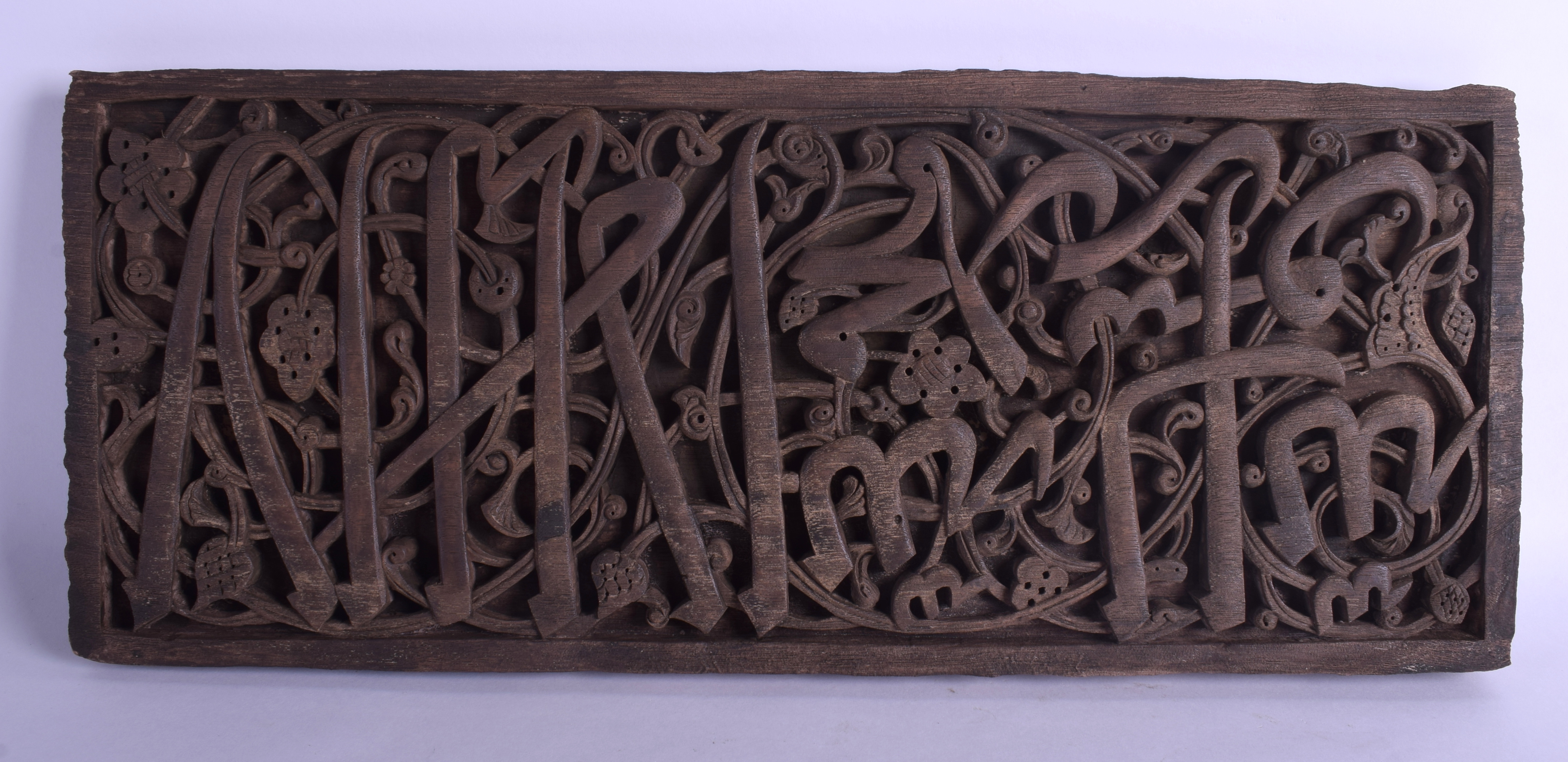 AN UNUSUAL TURKISH MIDDLE EASTERN CARVED WOOD CALLIGRAPHY PANEL formed with swirling motifs. 50 cm