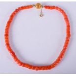 AN 18CT GOLD AND CORAL NECKLACE. 36 grams. 40 cm long.