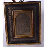 AN EARLY 20TH CENTURY FRAMED TIN PLAQUE, depicting a marriage. 31 cm x 26 cm.