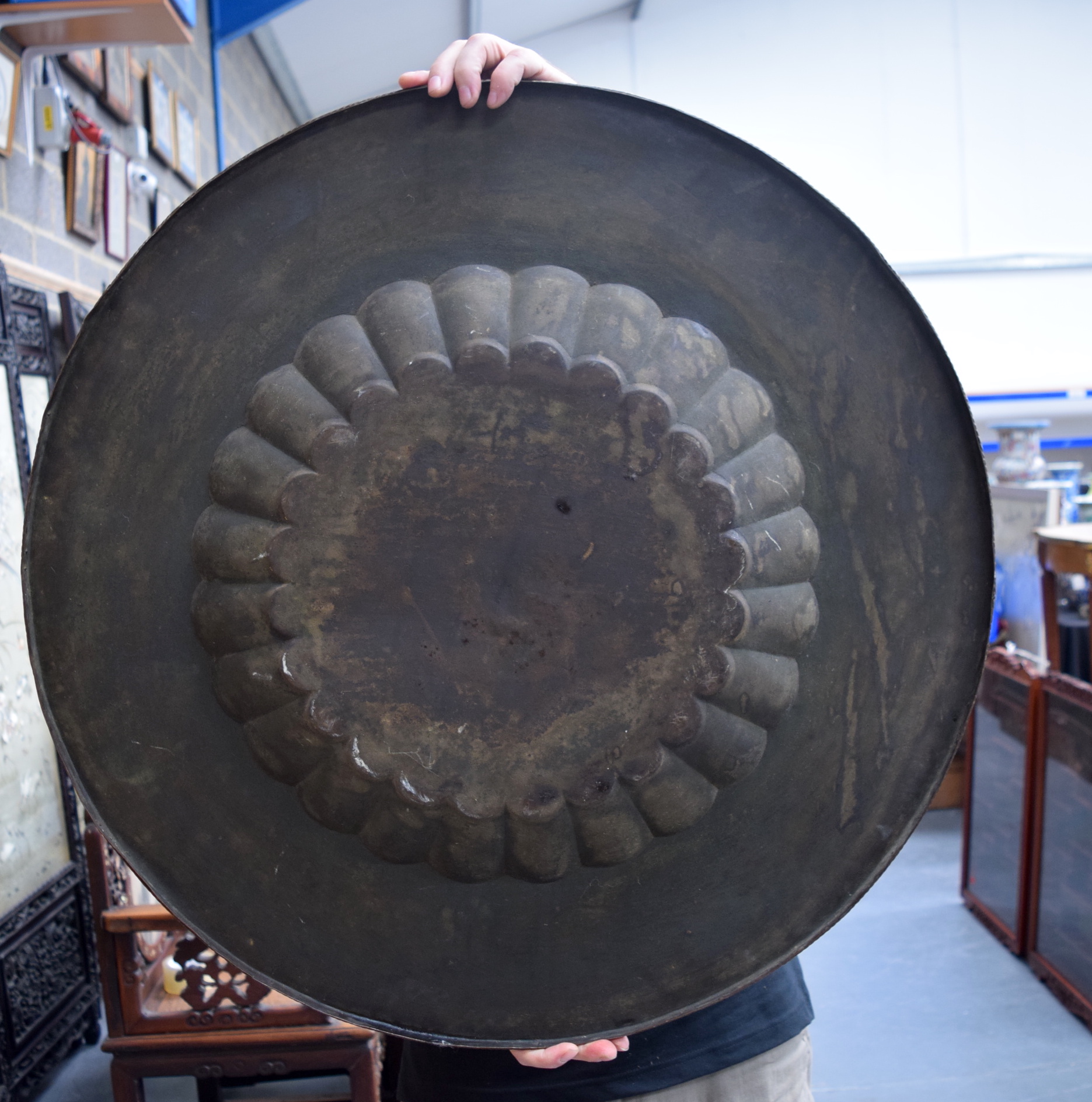 AN EARLY 20TH CENTURY INDIAN BRASS CHARGER, engraved with figures in various pursuits. 76 cm wide. - Image 3 of 3