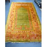 AN EARLY 20TH CENTURY ISLAMIC ORANGE GROUD PRAYER MAT RUG, bearing possible signature. 215 cm x 121