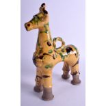 A TURKISH CANAKKALE POTTERY HORSE painted with green splash decoration. 25 cm x 15 cm.