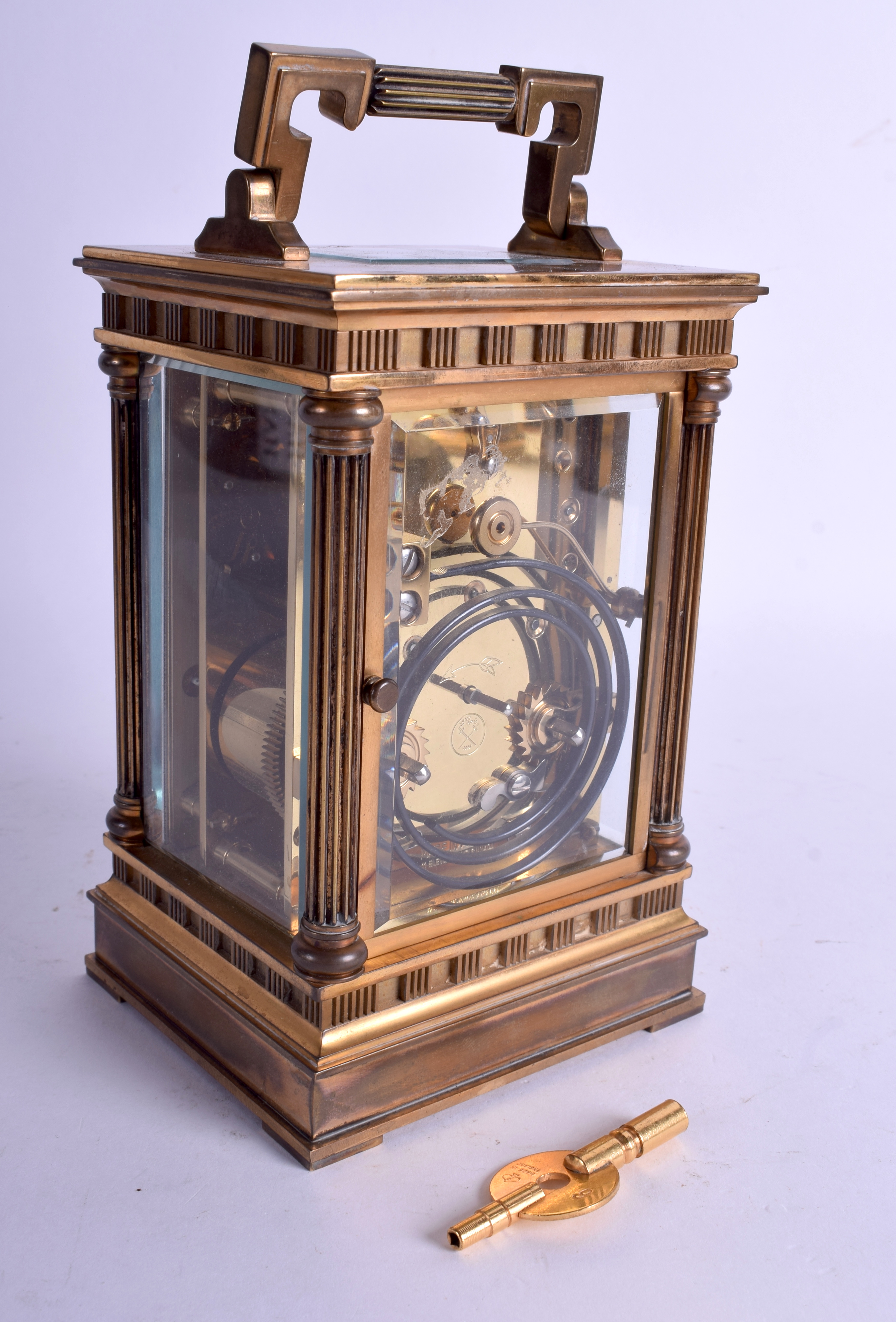 A GOOD FRENCH L'EPPE CARRIAGE CLOCK with classical column supports. 18 cm high inc handle. - Image 2 of 3