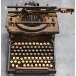 AN AMERCIAN ANTIQUE TYPEWRITER, “American Writing Machine Co. New York”. 31 cm wide.