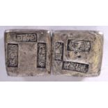 A PAIR OF CHINESE WHITE METAL INGOTS, bearing stamp. 4.5 cm wide.