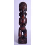 A MAORI TRIBAL SOUTHSEA ISLANDS HARDWOOD FIGURE modelled with abalone inset eyes, engraved with mot