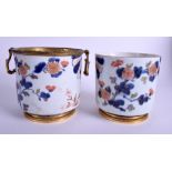 A PAIR OF 17TH CENTURY JAPANESE IMARI PORCELAIN CACHE POTS C1680 painted with raised foliage. 14 cm