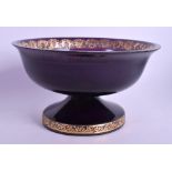 A MOSER AUBERGINE GLASS PEDESTAL BOWL engraved with gilt foliage. 18 cm x 12 cm.