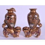 A PAIR OF 19TH CENTURY JAPANESE MEIJI PERIOD SATSUMA FOO DOG VASES painted with immortals. 15 cm x