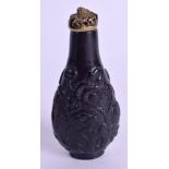 AN 18TH CENTURY CHINESE CARVED BLACK HARDSTONE SNUFF BOTTLE Qianlong, possibly jade and from the Im