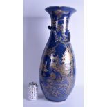 A VERY LARGE 19TH CENTURY CHINESE BLUE GROUND VASE Qing, painted with gilt dragons and phoenix bird