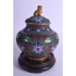 AN EARLY 20TH CENTURY CHINESE CLOISONNE ENAMEL JAR AND COVER decorated with foliage. 13 cm high. (2