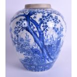 A 19TH CENTURY JAPANESE MEIJI PERIOD BLUE AND WHITE ARITA JAR painted with flowering trees. 25 cm x