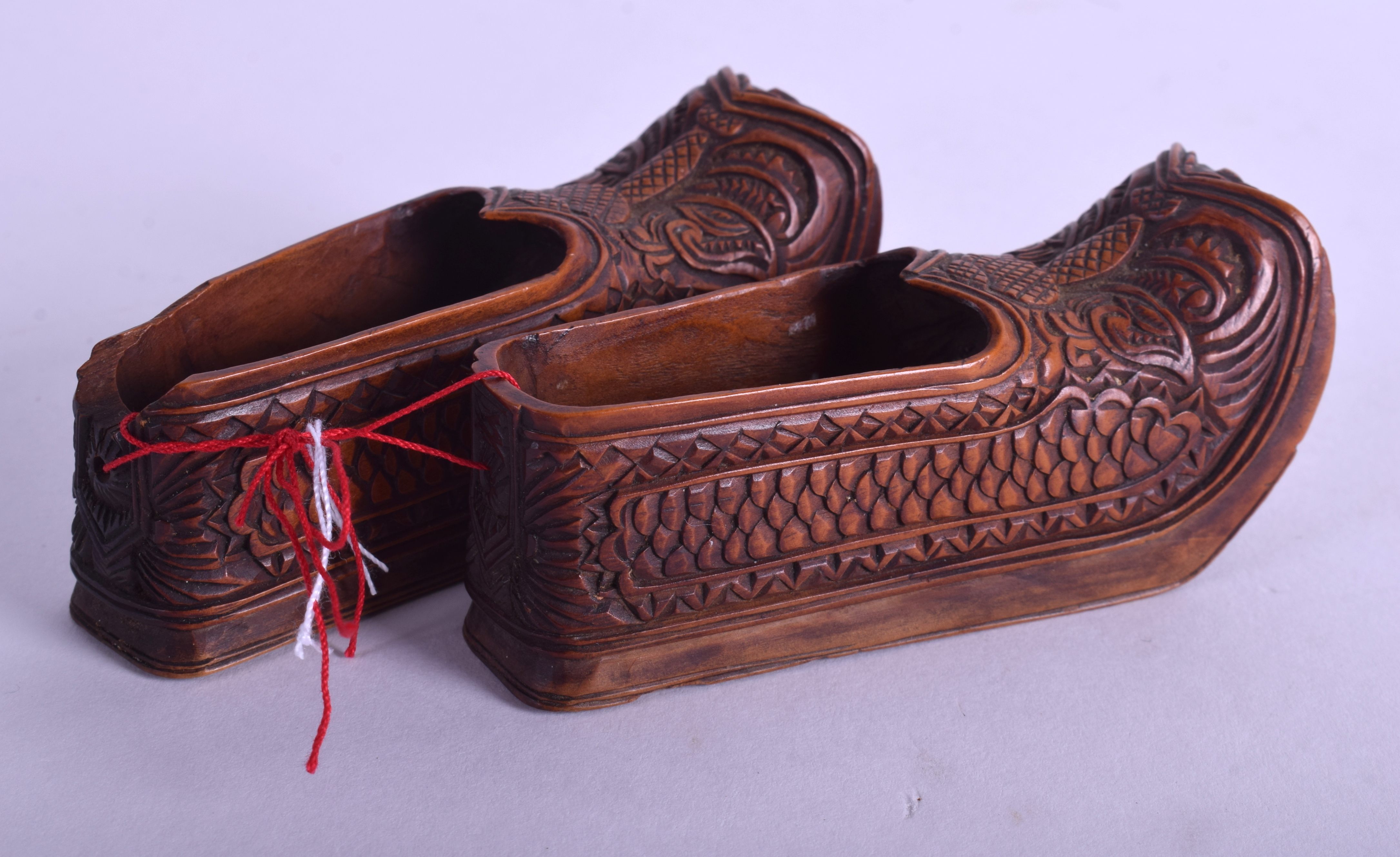 A PAIR OF 19TH CENTURY CONTINENTAL FRUITWOOD CLOGS carved with motifs. 8 cm long. - Image 2 of 4