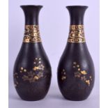 A GOOD PAIR OF 19TH CENTURY JAPANESE MEIJI PERIOD GOLD ONLAID IRON VASES decorated with clouds and
