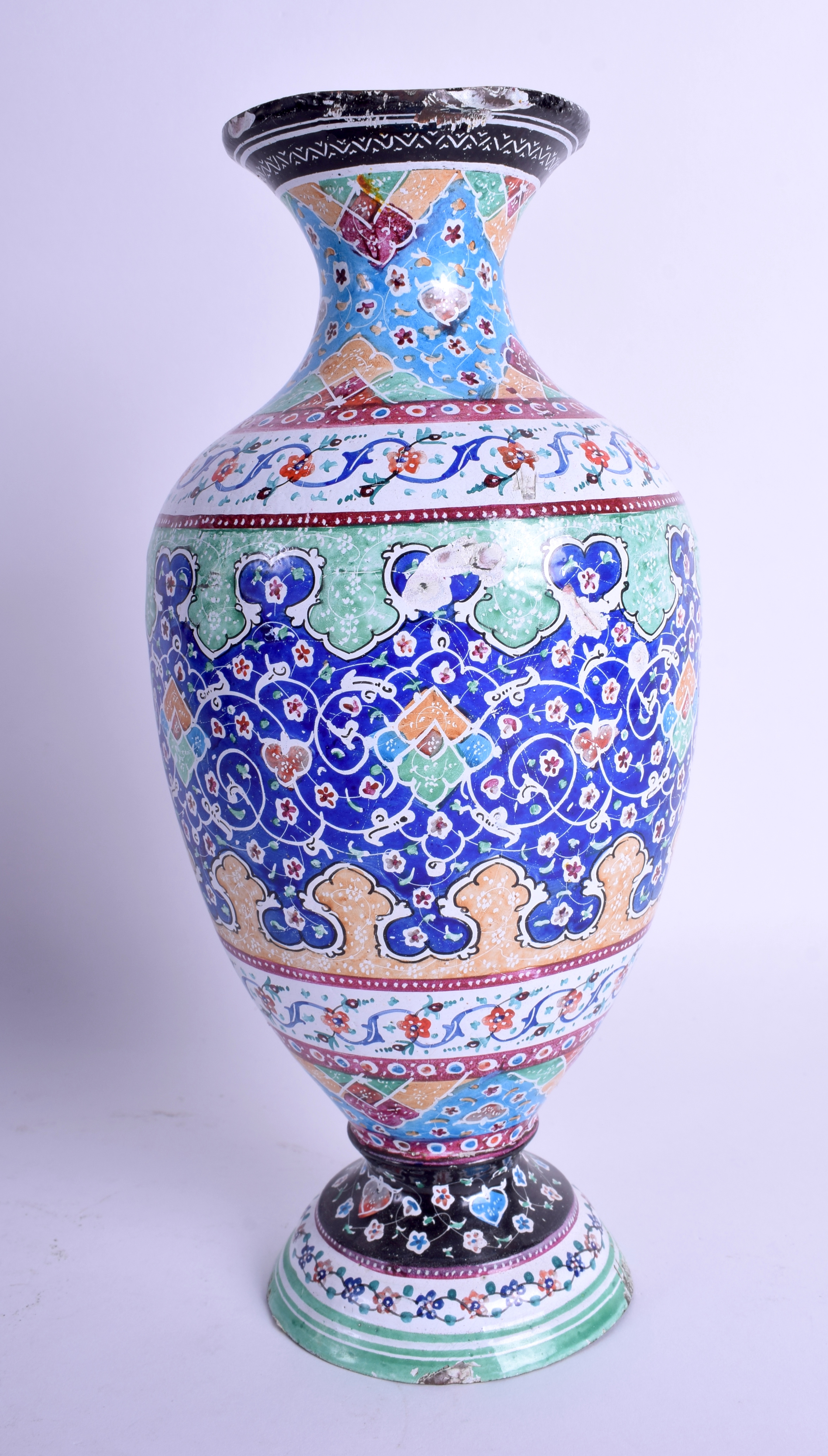 AN EARLY 20TH CENTURY PERSIAN ENAMEL VASE decorated with foliage and scrolling motifs. 25 cm high.