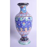 AN EARLY 20TH CENTURY PERSIAN ENAMEL VASE decorated with foliage and scrolling motifs. 25 cm high.