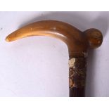 A VICTORIAN RHINOCEROS HORN HANDLED WALKING CANE, formed with bulbous tip and gold collar. 80 cm lo