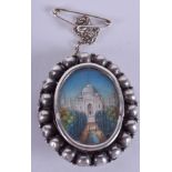 AN ANTIQUE SILVER AND IVORY INDIAN MINIATURE BROOCH. 3 cm x 3.5 cm.