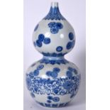 A CHINESE BLUE AND WHITE DOUBLE GOURD PORCELAIN VASE, decorated with stylised foliage and greek key