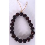 A CHINESE HARDWOOD BRACELET, formed with spherical beads. 13 cm wide.