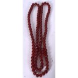 A CARVED RED AGATE PUMPKIN BEAD NECKLACE, formed ribbed beads. 102 cm long.