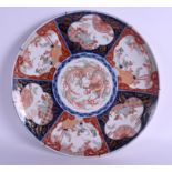 A VERY LARGE 19TH CENTURY JAPANESE MEIJI PERIOD IMARI CHARGER painted dragons and insects. 44 cm di