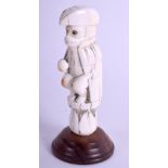 AN 18TH CENTURY CARVED CONTINENTAL IVORY FIGURE OF A MONKEY in the form of a naval officer. Ivory 7