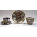 A CHINESE FAMILLE ROSE CANTON ENAMEL PORCELAON TEA CUP AND SAUCER, together with a Japanese example