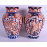 A LARGE PAIR OF 19TH CENTURY JAPANESE MEIJI PERIOD IMARI VASES painted with flowers. 32 cm high.