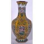 A CHINESE YELLOW GROUND PORCELAIN RETICULATED VASE, decorated with extensive foliage and bearing Qi