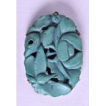 A 19TH CENTURY CHINESE CARVED TURQUOISE SILVER PENDANT of naturalistic form. Turquoise 2.5 cm x 3.5