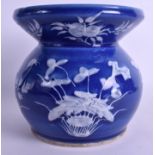 A VERY RARE 19TH CENTURY CHINESE BLUE GROUND SPITTOON Daoguang, painted in white enamel with floral