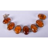 A SILVER AND AMBER BRACELET. 22 cm long.