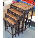 AN EARLY 20TH CENTURY CHINESE HARDWOOD NEST OF TABLES, carved with foliate frieze and bamboo type d