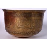 AN 18TH CENTURY ISLAMIC BRONZE BOWL, engraved with script within foliate banding. 13 cm x 22.5 cm.