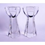 A PAIR OF FRENCH BACCARAT CRYSTAL CANDLESTICKS. 18 cm high.