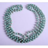 AN EARLY 20TH CENTURY CHINESE ICEY JADEITE NECKLACE. 170 cm long.