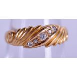 AN 18CT GOLD AND DIAMOND RING. 1.8 grams. Size K.