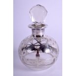 AN EDWARDIAN ART NOUVEAU SILVER OVERLAID GLASS SCENT BOTTLE. 9.5 cm high.