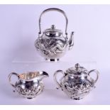A GOOD 19TH CENTURY JAPANESE MEIJI PERIOD SILVER TEASET decorated with dragons upon a hammered grou
