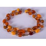 AN EARLY 20TH CENTURY AMBER NECKLACE. 7.8 grams. 18 cm long.