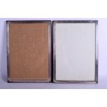 A LARGE MATCHED PAIR OF ENGLISH SILVER PHOTOGRAPH FRAMES. 29 cm x 40 cm.