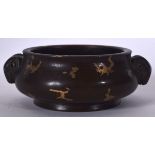 A 20TH CENTURY CHINESE BRONZE GOLD SPLASH INCENSE BURNER, formed with ram mask head handles. 12.5 c